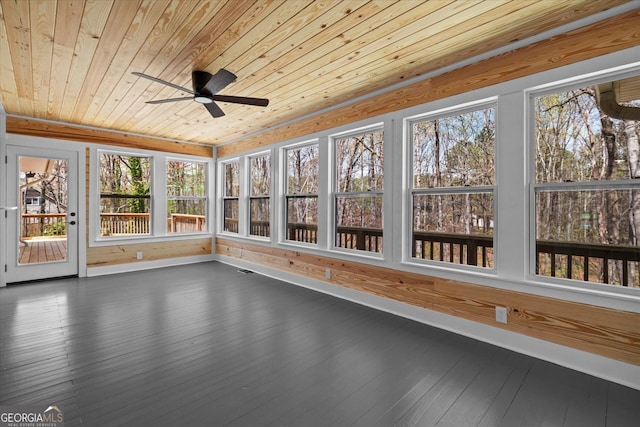 unfurnished sunroom featuring wooden ceiling and hardwood / wood-style flooring