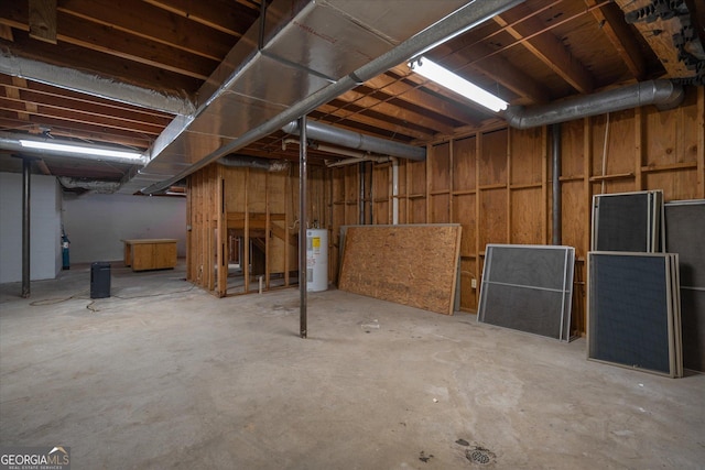 unfinished basement featuring water heater