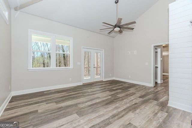 4660 Perry Rd, Gainesville, GA 30506 - unfurnished room with wood finished floors, a ceiling fan, and high vaulted ceiling