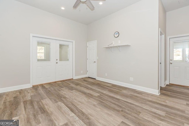 4660 Perry Rd, Gainesville, GA 30506 - empty room with light wood-style floors, ceiling fan, recessed lighting, and french doors