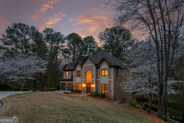 275 Tynebrae Pl, Roswell, GA 30075 - french country style house with concrete driveway, a yard, and a garage