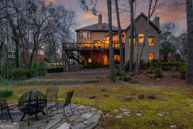 275 Tynebrae Pl, Roswell, GA 30075 - wooden deck with outdoor dining space and an outdoor living space with a fire pit