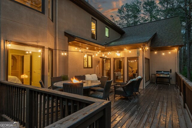 275 Tynebrae Pl, Roswell, GA 30075 - deck at dusk featuring an outdoor fire pit