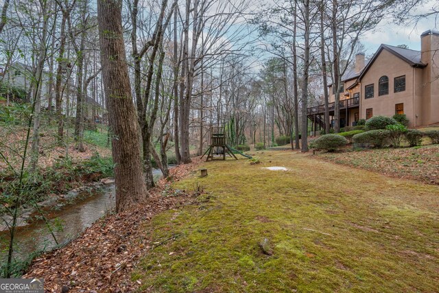 275 Tynebrae Pl, Roswell, GA 30075 - rear view of property with a chimney, a patio area, stairway, and a wooden deck