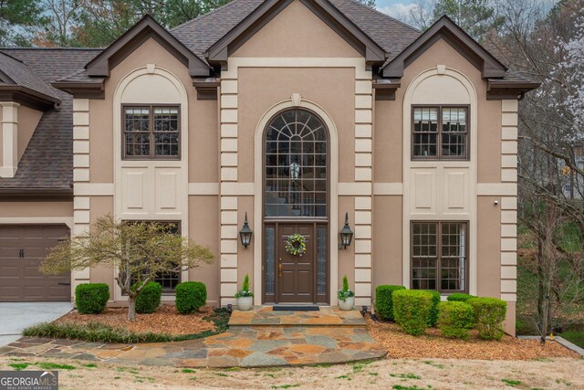 275 Tynebrae Pl, Roswell, GA 30075 - entrance foyer with stairs, crown molding, wood finished floors, arched walkways, and a high ceiling