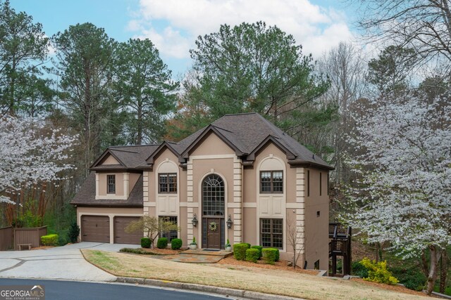 275 Tynebrae Pl, Roswell, GA 30075 - view of front of house with driveway, stucco siding, roof with shingles, and an attached garage