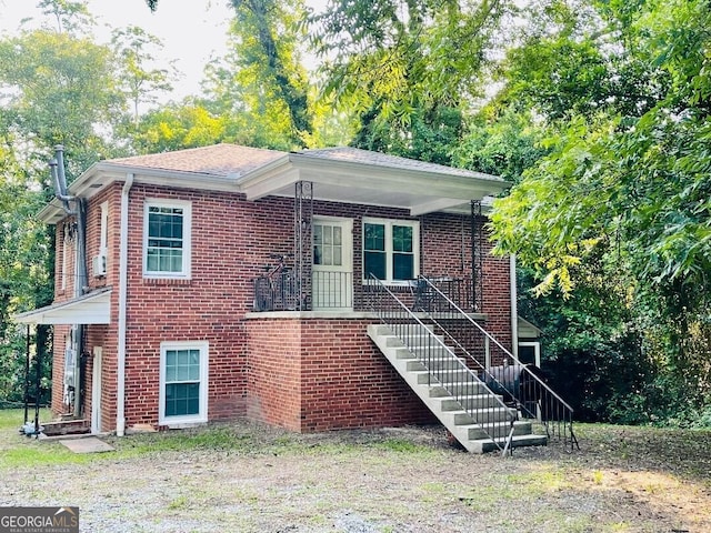 107 Little St SE, Milledgeville, GA 31061 - view of front of house with stairway and brick siding