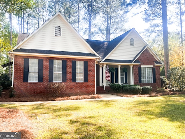 198 Oakdale Rd SE, Cairo, GA 39828 - view of front facade featuring brick siding, a shingled roof, and a front lawn
