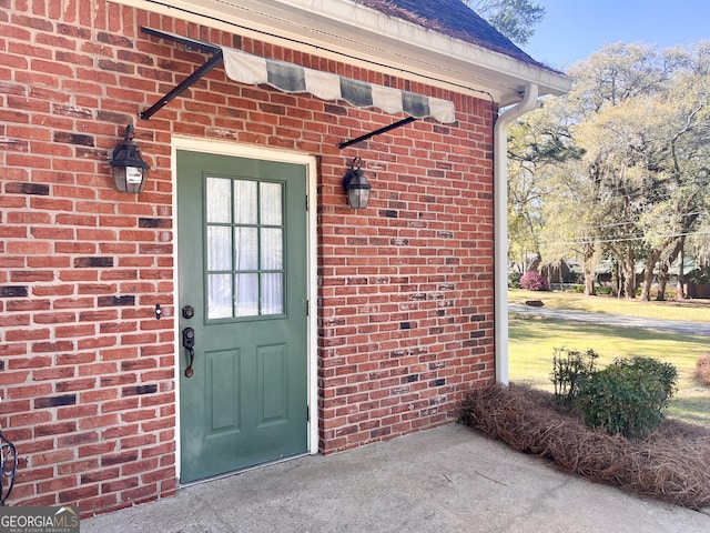 198 Oakdale Rd SE, Cairo, GA 39828 - view of exterior entry featuring brick siding
