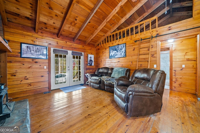 335 Misty Hollow Rd, Ellijay, GA 30536 - living room with beam ceiling, french doors, wood ceiling, light wood-style floors, and wooden walls