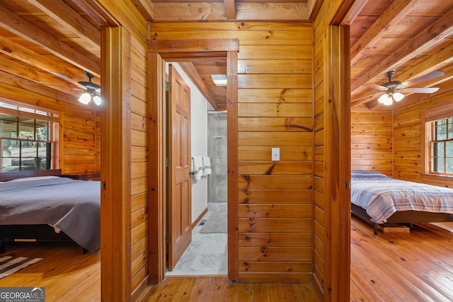 335 Misty Hollow Rd, Ellijay, GA 30536 - bedroom with wooden walls, hardwood / wood-style floors, beam ceiling, and a sauna