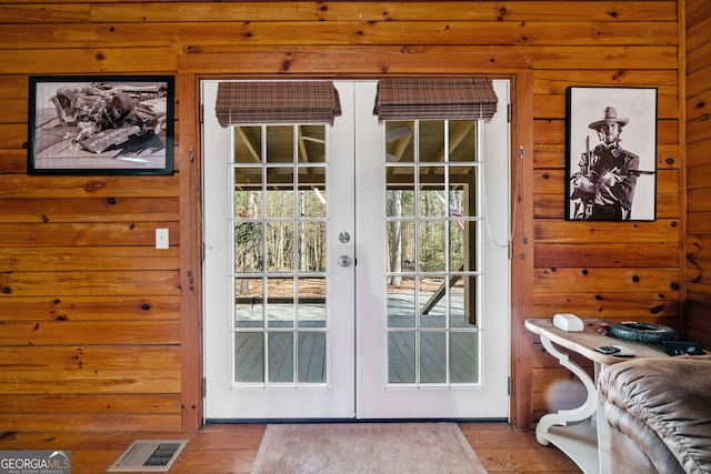 335 Misty Hollow Rd, Ellijay, GA 30536 - doorway featuring french doors, wooden walls, and wood finished floors