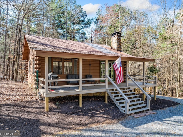 335 Misty Hollow Rd, Ellijay, GA 30536 - view of front of home featuring log veneer siding, metal roof, a chimney, and stairs