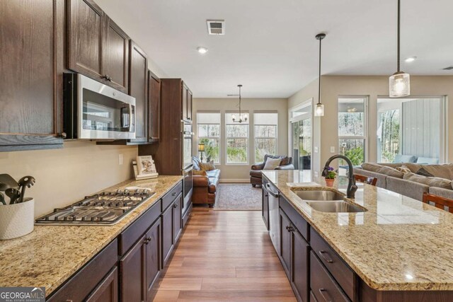 67 Narrowleaf Ln, Dallas, GA 30157 - kitchen featuring open floor plan, a sink, appliances with stainless steel finishes, and visible vents