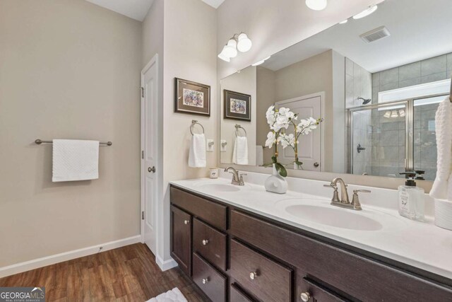 67 Narrowleaf Ln, Dallas, GA 30157 - bathroom with visible vents, a sink, a stall shower, and double vanity