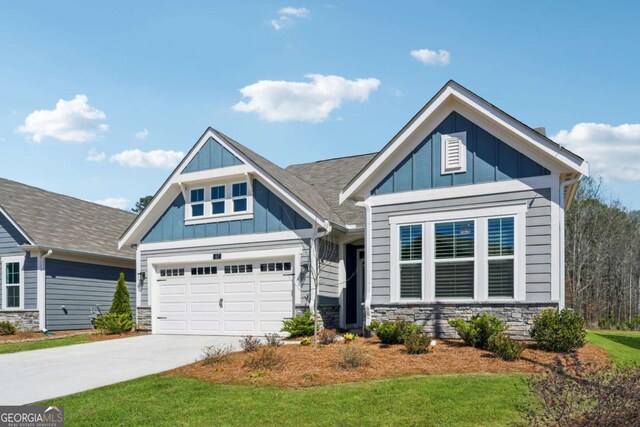 67 Narrowleaf Ln, Dallas, GA 30157 - craftsman inspired home with an attached garage, stone siding, board and batten siding, and concrete driveway