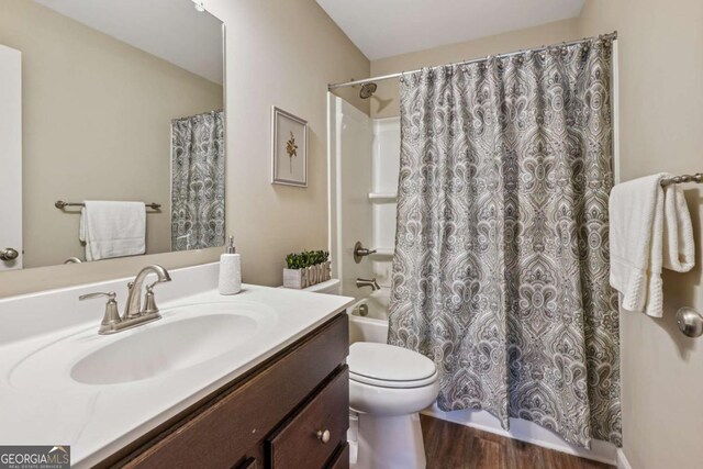 67 Narrowleaf Ln, Dallas, GA 30157 - full bath with shower / bath combo with shower curtain, vanity, toilet, and wood finished floors