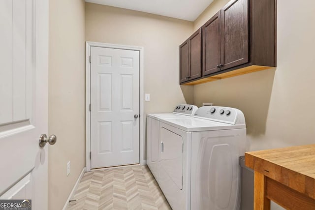 67 Narrowleaf Ln, Dallas, GA 30157 - laundry area with baseboards, washing machine and dryer, and cabinet space