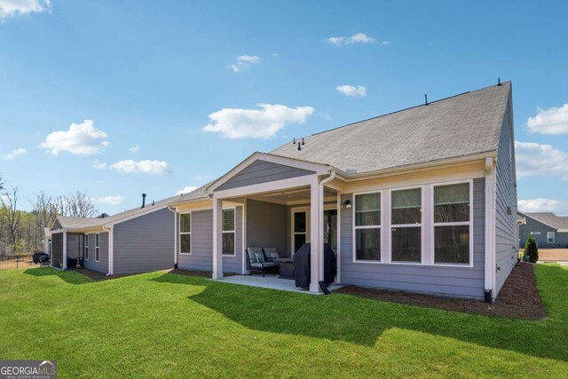 67 Narrowleaf Ln, Dallas, GA 30157 - back of property with a yard and a patio area