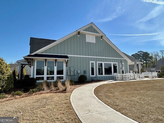 67 Narrowleaf Ln, Dallas, GA 30157 - back of property featuring a patio area and board and batten siding