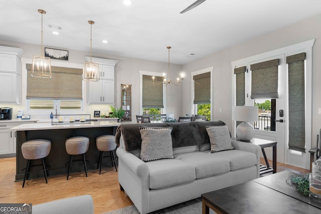 24 Harrison Ln, Blue Ridge, GA 30513 - living area with light wood-style flooring, a notable chandelier, visible vents, and recessed lighting