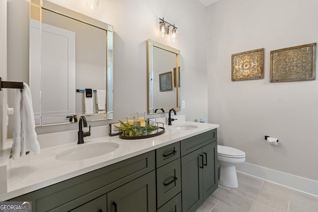 24 Harrison Ln, Blue Ridge, GA 30513 - full bathroom with double vanity, baseboards, a sink, and toilet