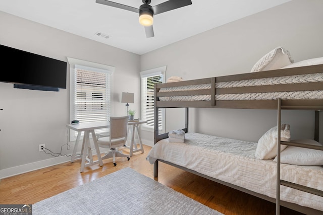 24 Harrison Ln, Blue Ridge, GA 30513 - bedroom featuring wood finished floors, ceiling fan, baseboards, and visible vents