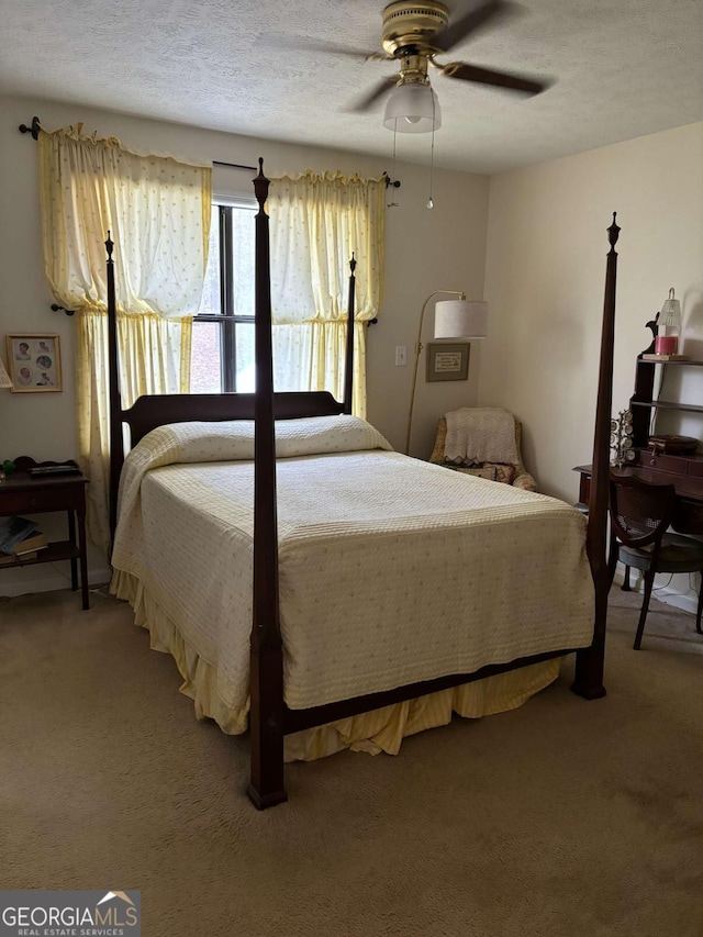 575 Lake Laurel Rd, Milledgeville, GA 31061 - bedroom with a textured ceiling, light carpet, and ceiling fan
