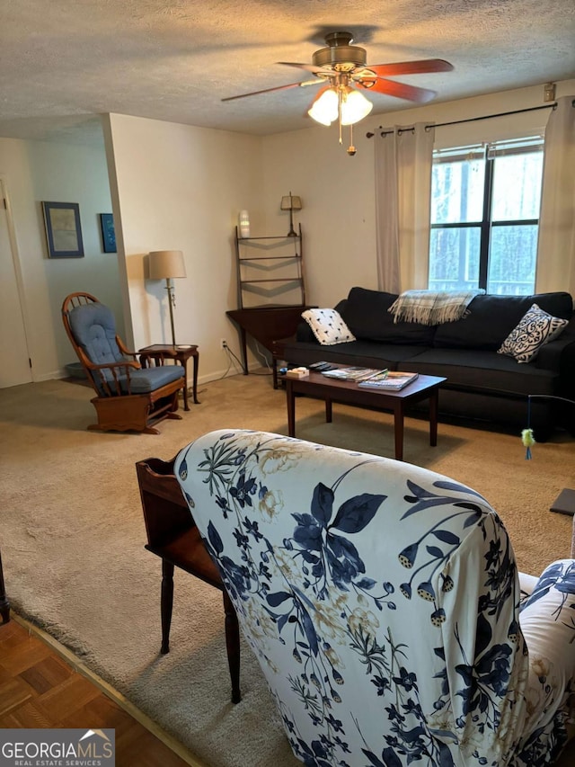 575 Lake Laurel Rd, Milledgeville, GA 31061 - living area featuring a textured ceiling, carpet flooring, and a ceiling fan