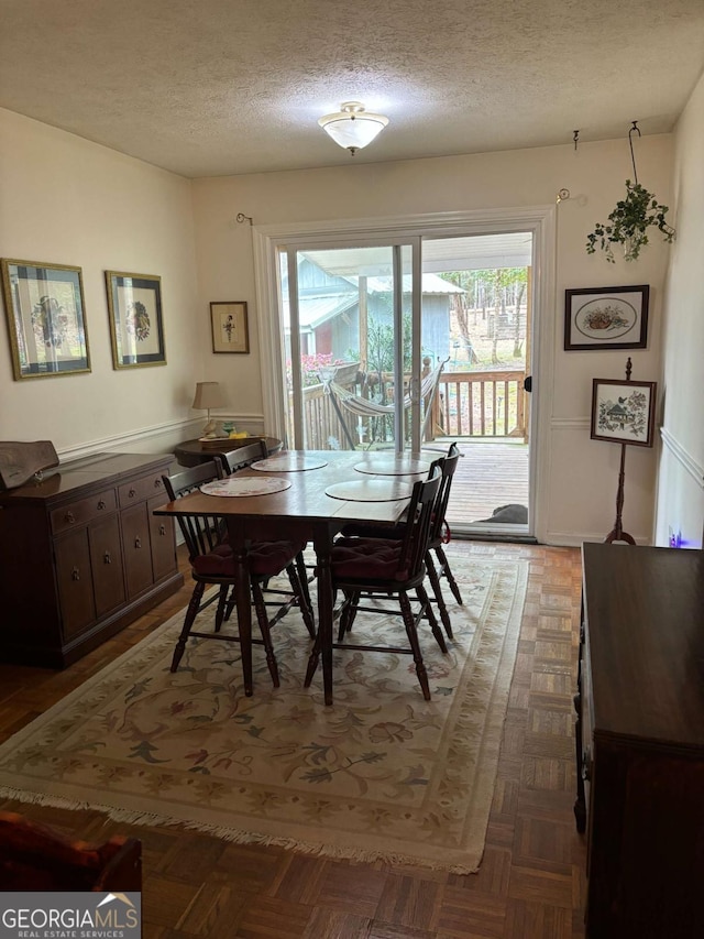 575 Lake Laurel Rd, Milledgeville, GA 31061 - dining area with a textured ceiling