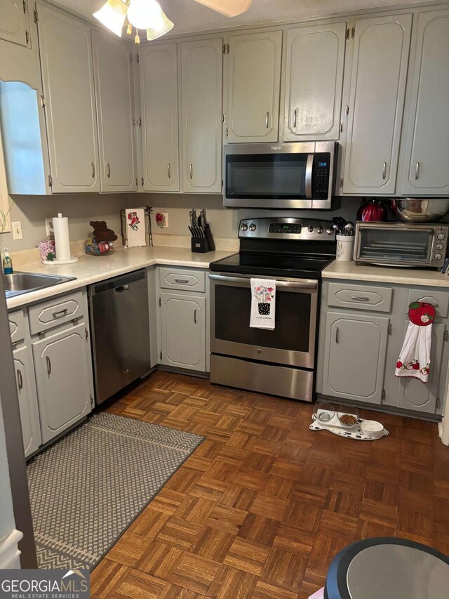 575 Lake Laurel Rd, Milledgeville, GA 31061 - kitchen with a toaster, light countertops, appliances with stainless steel finishes, and a sink
