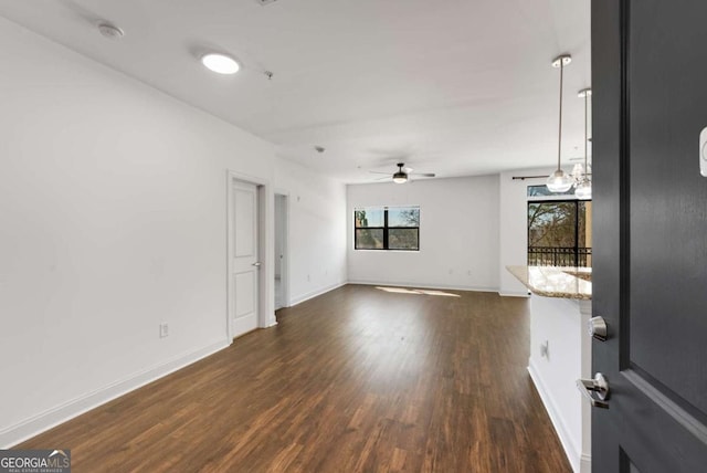 2230 Cheshire Bridge Rd NE Unit 410, Atlanta, GA 30324 - empty room with baseboards, dark wood-style flooring, and ceiling fan