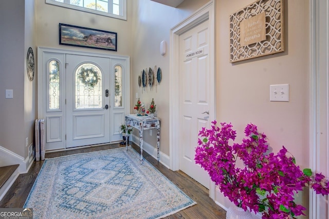 667 Cardinal Dr, Monticello, GA 31064 - entrance foyer with dark wood-style flooring and baseboards