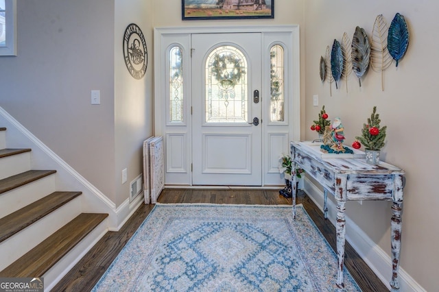 667 Cardinal Dr, Monticello, GA 31064 - entrance foyer featuring stairs, visible vents, wood finished floors, and baseboards