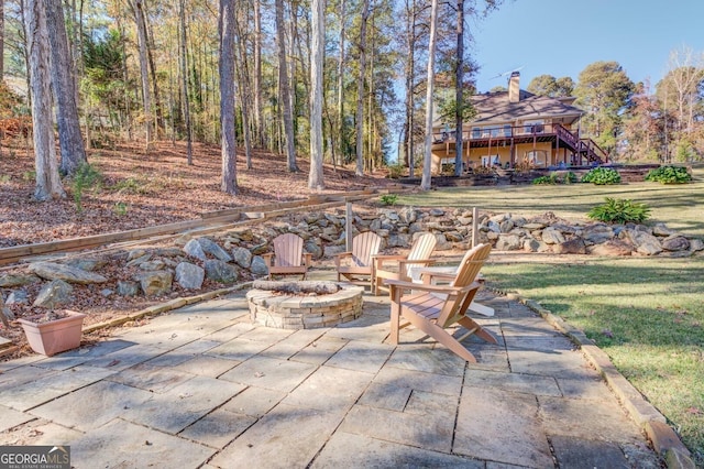 667 Cardinal Dr, Monticello, GA 31064 - view of patio / terrace featuring an outdoor fire pit, stairway, and a deck