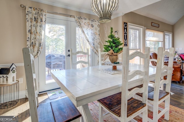 667 Cardinal Dr, Monticello, GA 31064 - dining area featuring a notable chandelier, crown molding, wood finished floors, and french doors