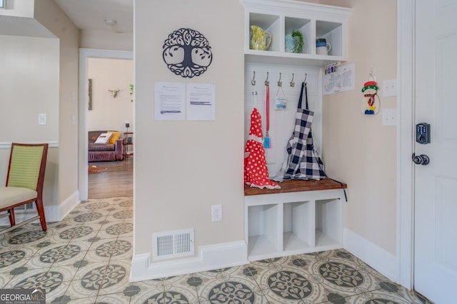 667 Cardinal Dr, Monticello, GA 31064 - mudroom with baseboards, visible vents, and light tile patterned floors
