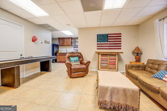 667 Cardinal Dr, Monticello, GA 31064 - living room with light tile patterned flooring, baseboards, and a drop ceiling
