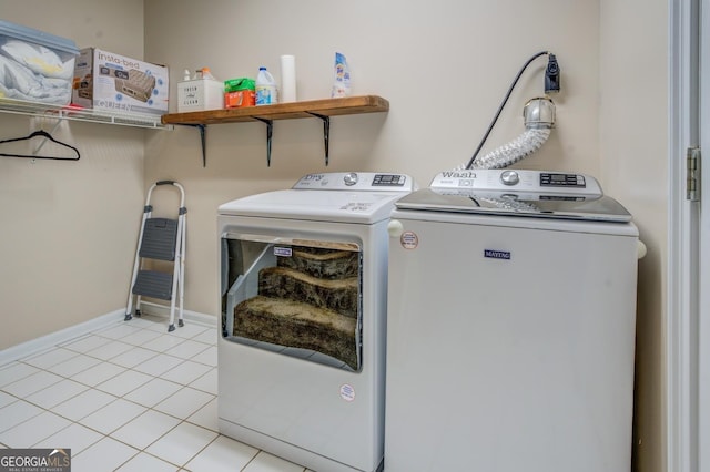 667 Cardinal Dr, Monticello, GA 31064 - washroom featuring light tile patterned flooring, baseboards, washer and dryer, and laundry area