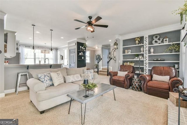 5753 Porch Swing Pl, Hoschton, GA 30548 - living room with crown molding, a ceiling fan, and recessed lighting