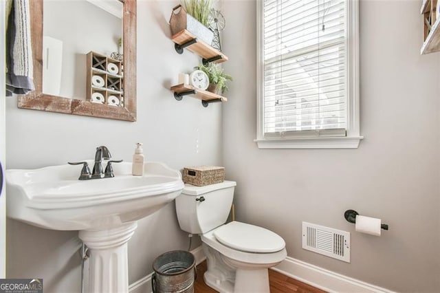 5753 Porch Swing Pl, Hoschton, GA 30548 - bathroom featuring toilet and wood finished floors