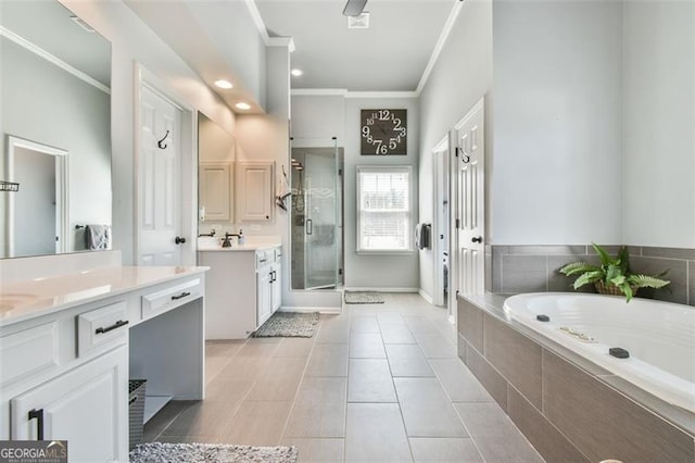 5753 Porch Swing Pl, Hoschton, GA 30548 - full bathroom featuring ornamental molding, two vanities, a stall shower, a bath, and tile patterned flooring