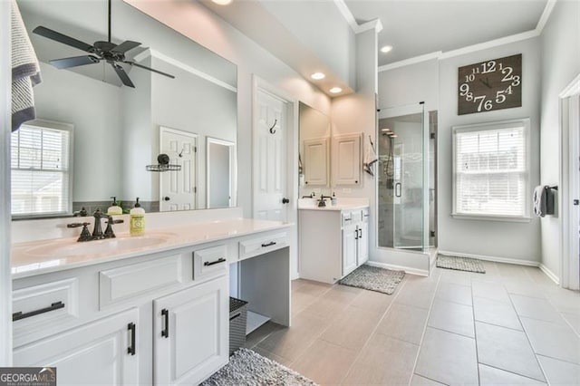 5753 Porch Swing Pl, Hoschton, GA 30548 - bathroom with a shower stall, two vanities, a ceiling fan, crown molding, and recessed lighting