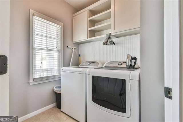 5753 Porch Swing Pl, Hoschton, GA 30548 - laundry room with cabinet space, independent washer and dryer, and light tile patterned flooring