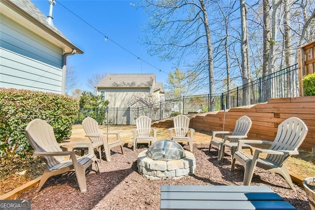 5753 Porch Swing Pl, Hoschton, GA 30548 - fenced backyard featuring a fire pit