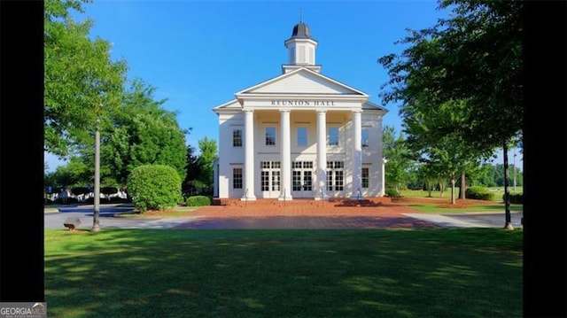 5753 Porch Swing Pl, Hoschton, GA 30548 - rear view of house featuring french doors and a lawn