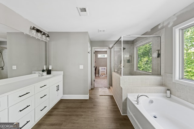 557 Winder Trl, Canton, GA 30114 - full bath with plenty of natural light, vanity, a bath, and a shower stall