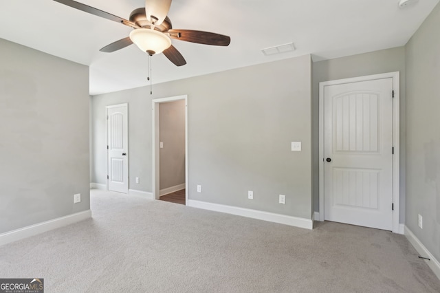 557 Winder Trl, Canton, GA 30114 - unfurnished bedroom featuring carpet floors and a ceiling fan