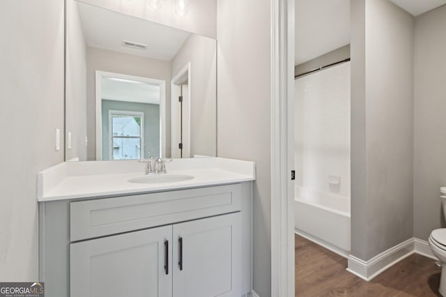 557 Winder Trl, Canton, GA 30114 - full bath with vanity, wood finished floors, and bathing tub / shower combination