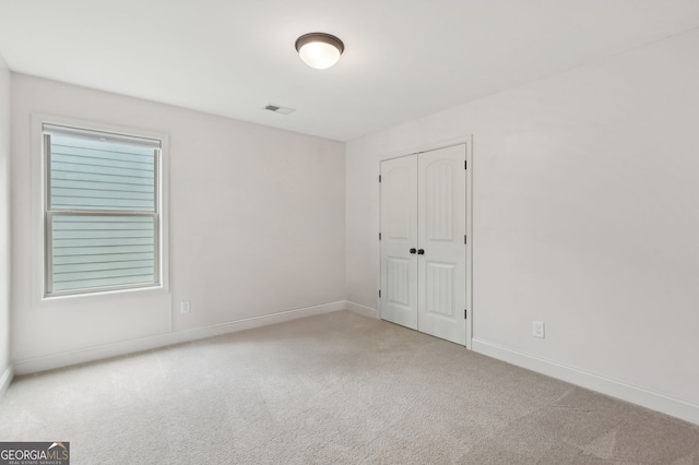 557 Winder Trl, Canton, GA 30114 - unfurnished bedroom with carpet flooring and a closet